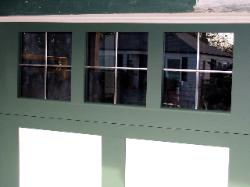A custom garage door, custom width and custom height, with true english leaded windows.